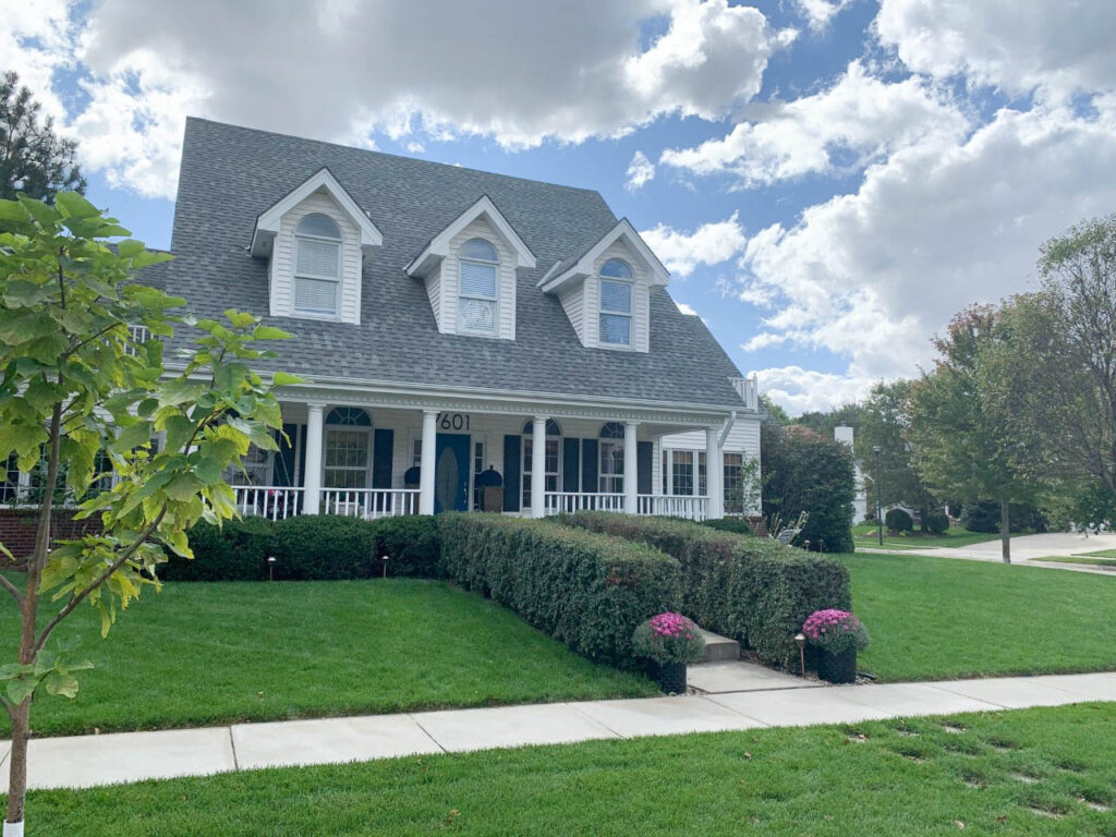 A white cape cod style home.