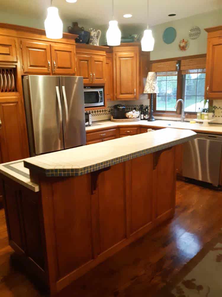 Kitchen cabinetry before its painted remodel.