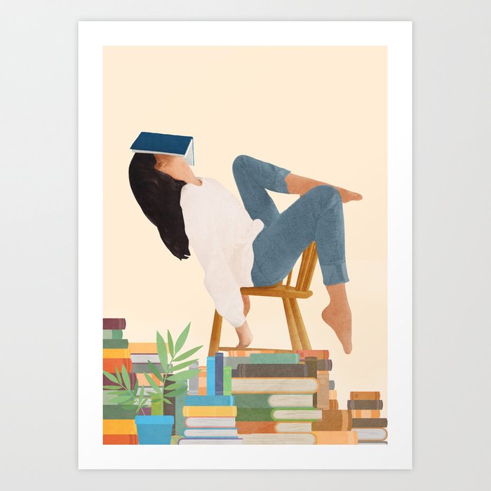 An art print of a woman reading a book on a chair.