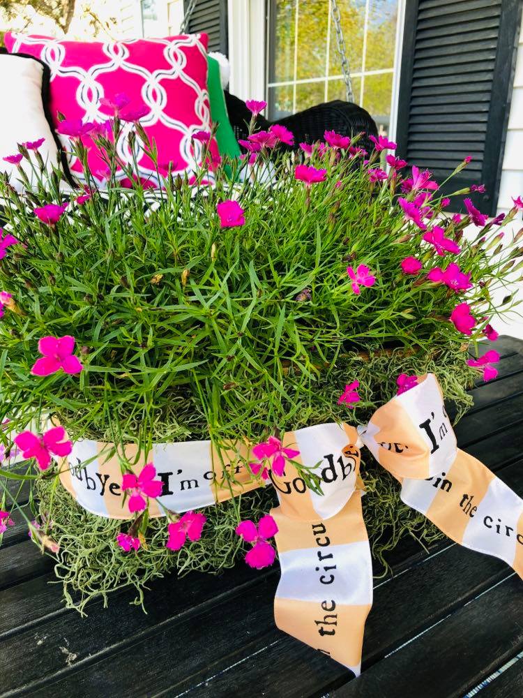 A May Day basket covered with springtime green moss.