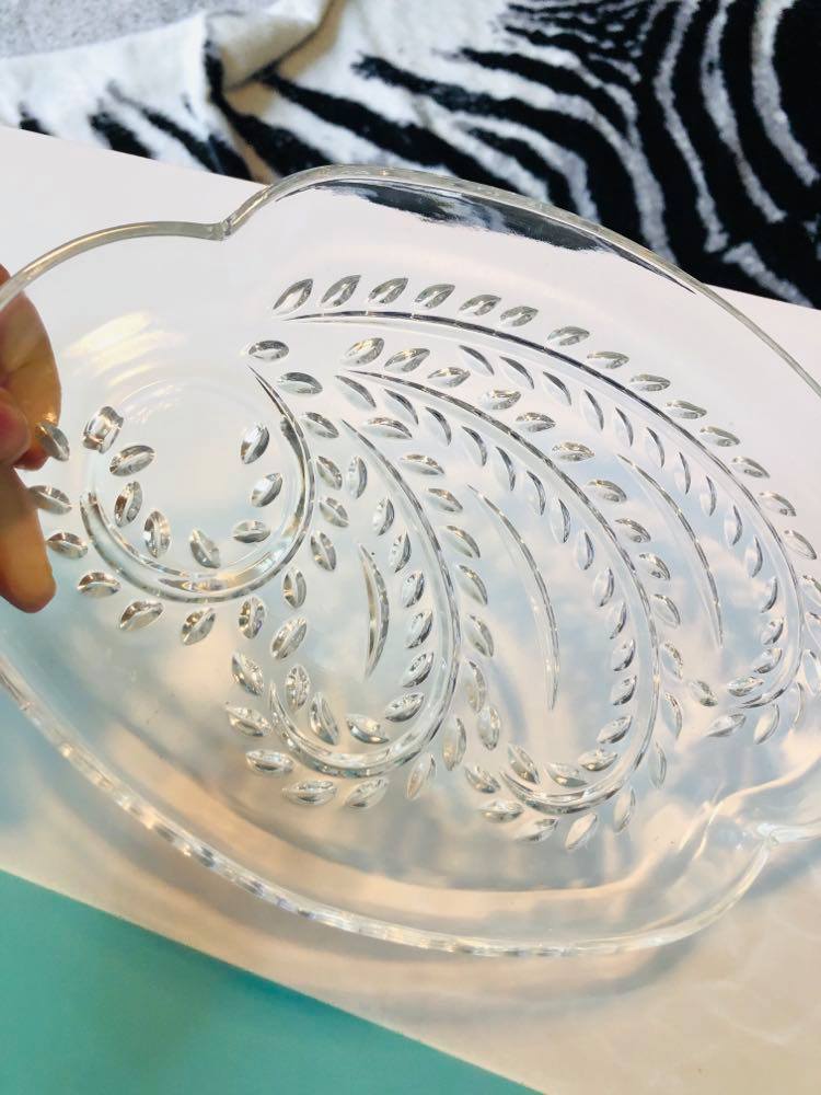 A clear cut glass snack plate.