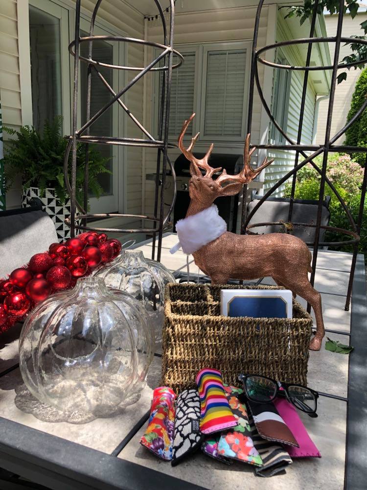 Yard sales finds that include two glass pumpkin shaped candle holders.