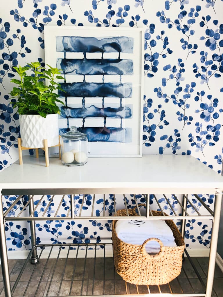 Blue and White wall art displayed as Spring home decor in a laundry room.