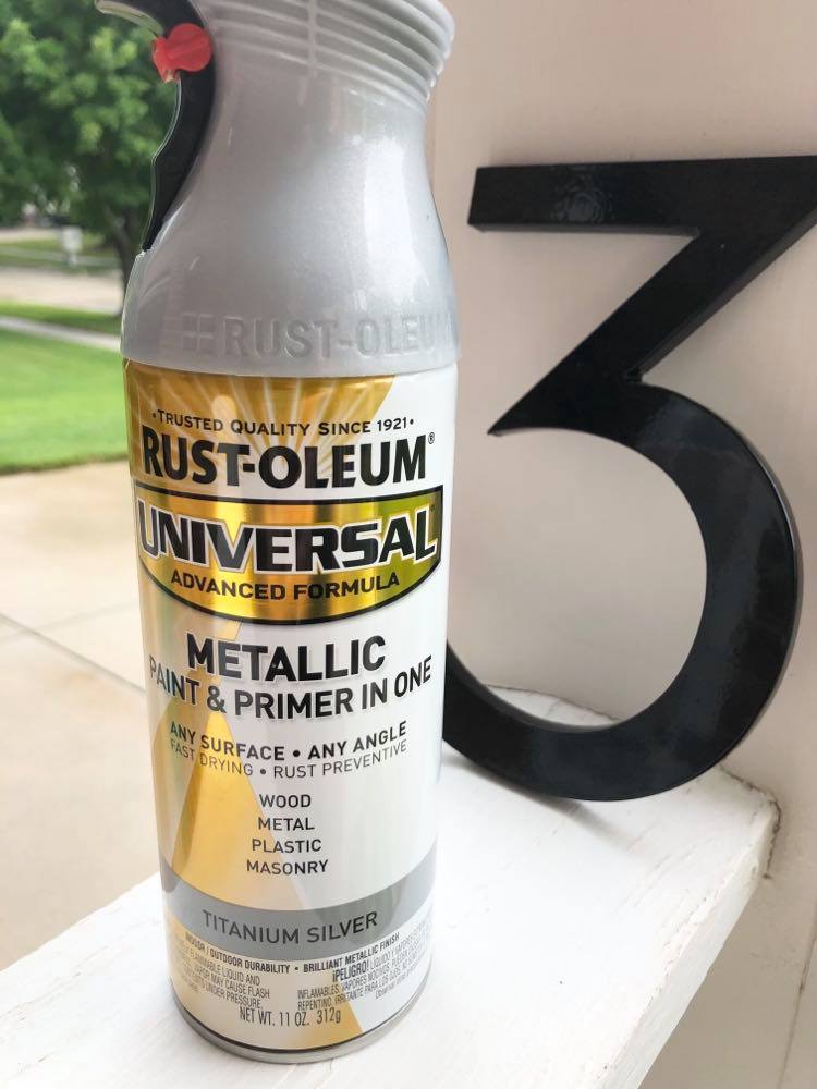A can of Rust-Oleum paint and primer spray paint.
