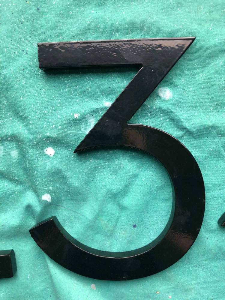 A number "3" house number before it is painted.