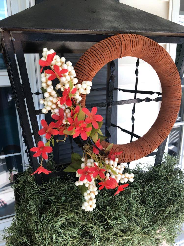 Fall wreath attached to lantern.