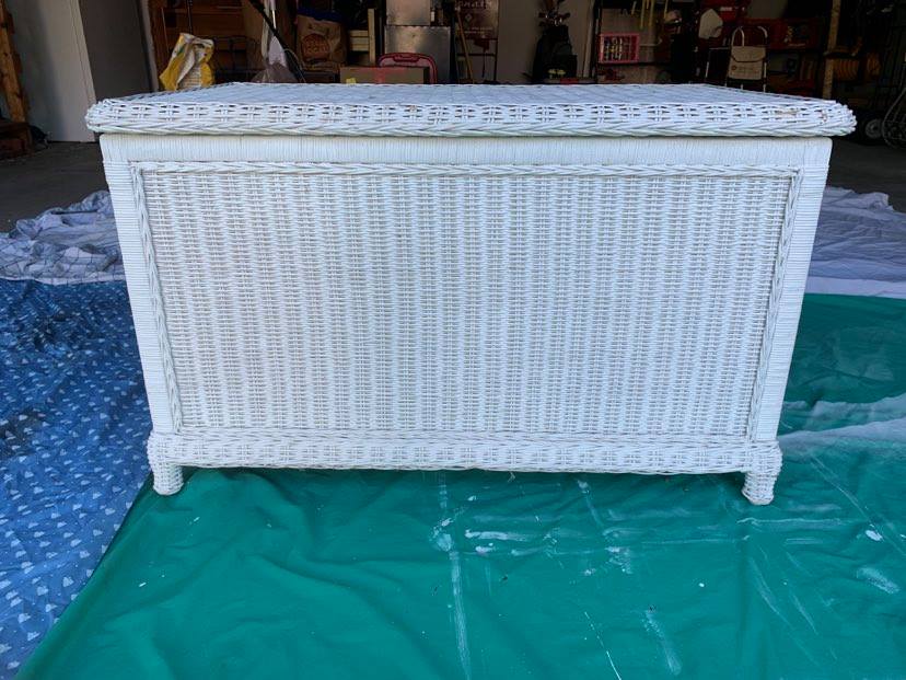 Spray paint stripes on this white wicker chest project