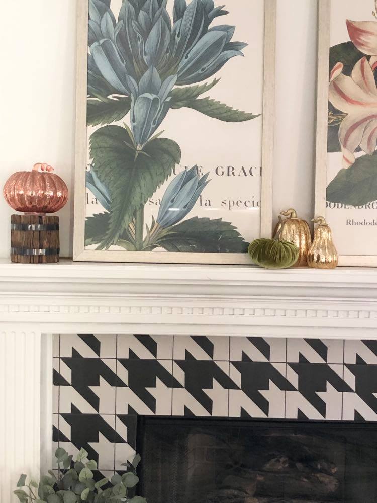 New fireplace styled with wall art and accessories.