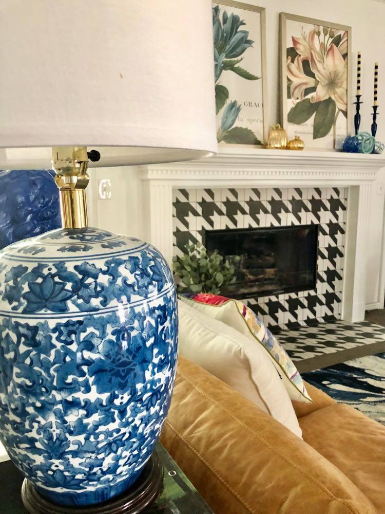 Side view of the newly tiled  fireplace with blue lamp.