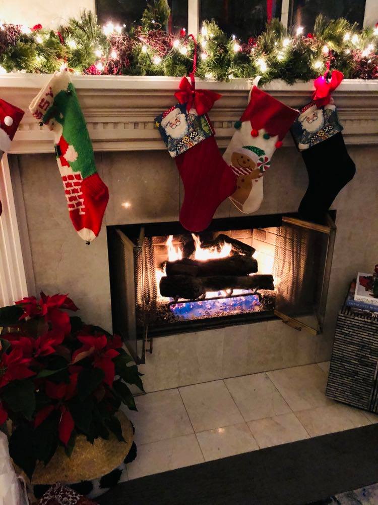 Christmas stockings hanging from a mental.