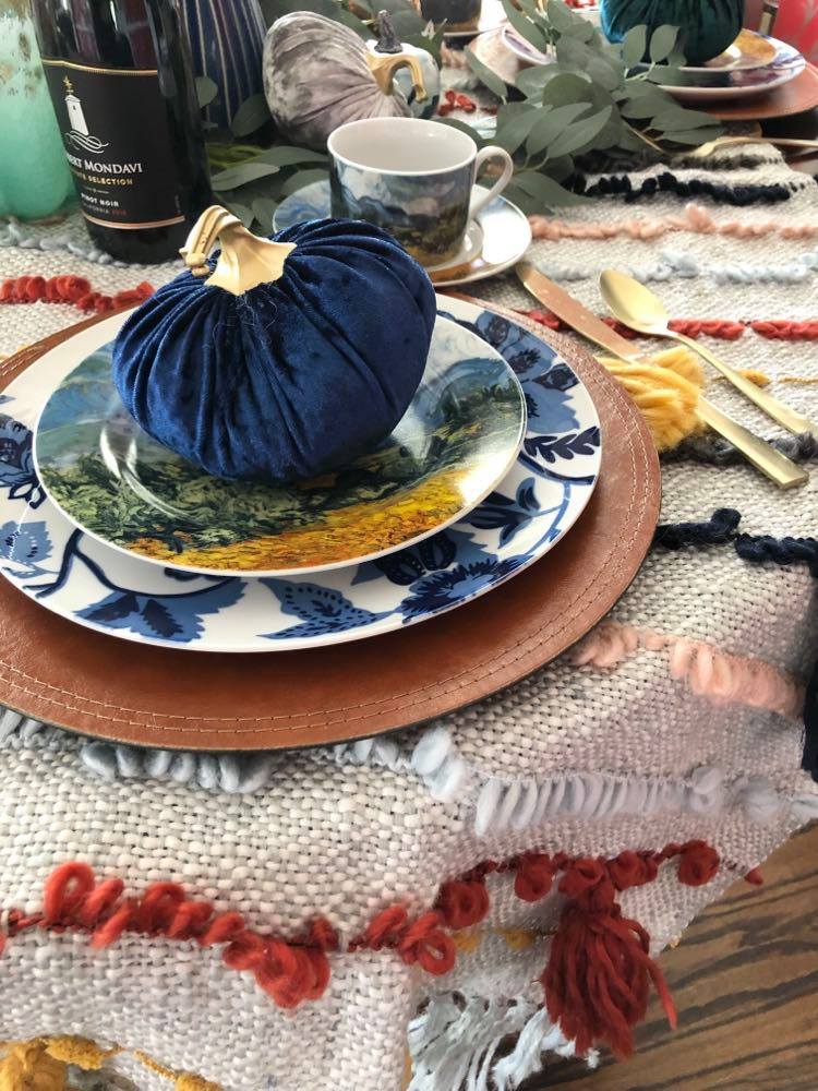 A velvet pumpkin on a plate.