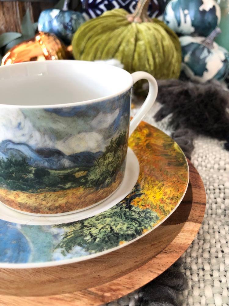 A cup and saucer in a Thanksgiving tablescape idea.