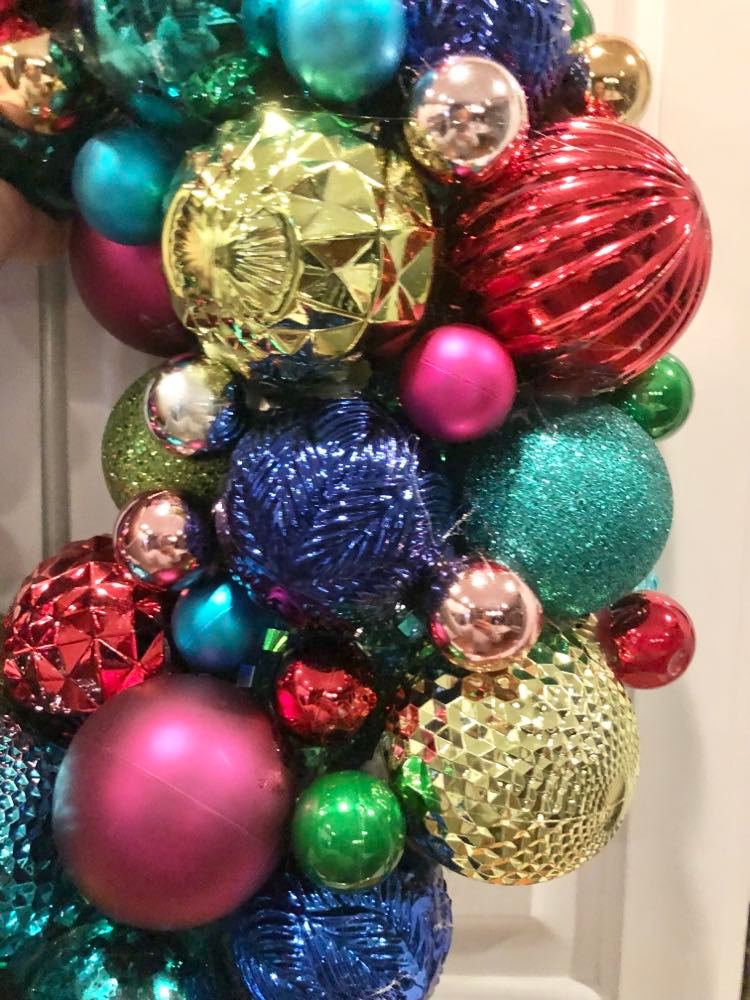 Colorful ornament balls on a wreath help create merry and bright holidays..