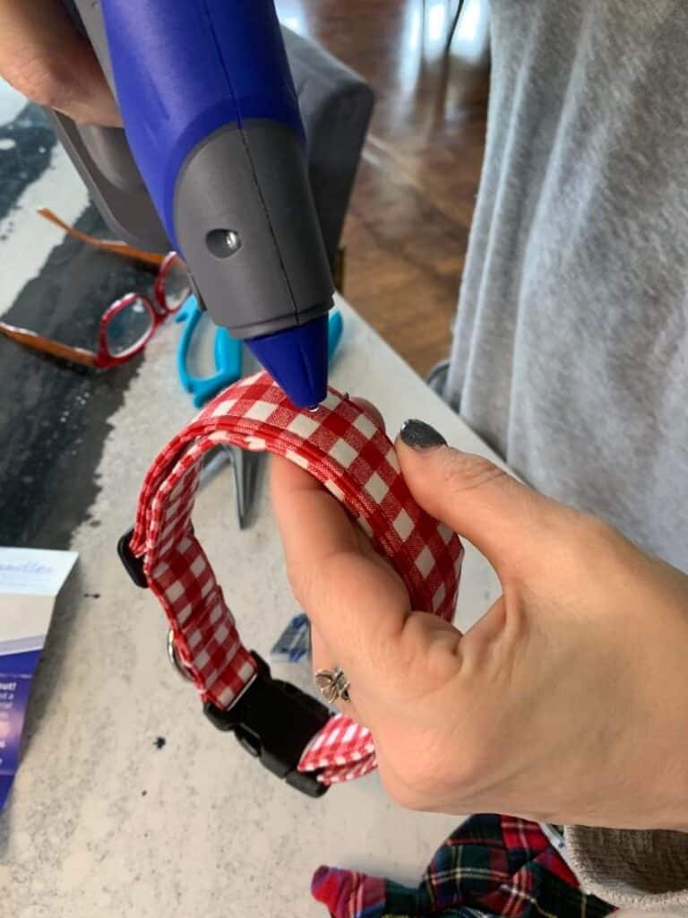Hot glueing velcro on to a dog collar.