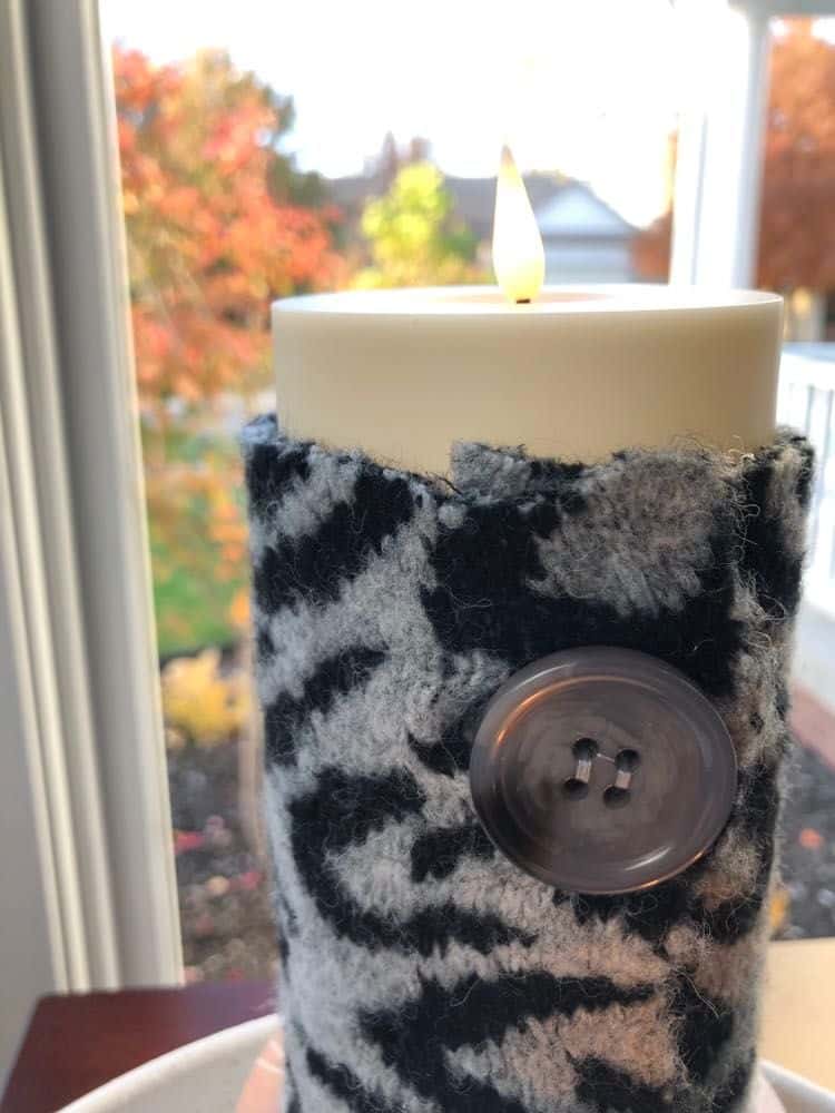 Animal print candle wrap with button.