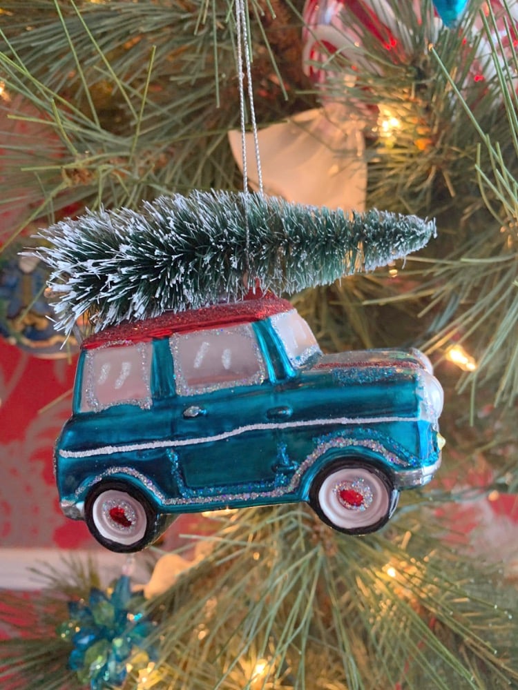 Car ornament hanging on the tree.