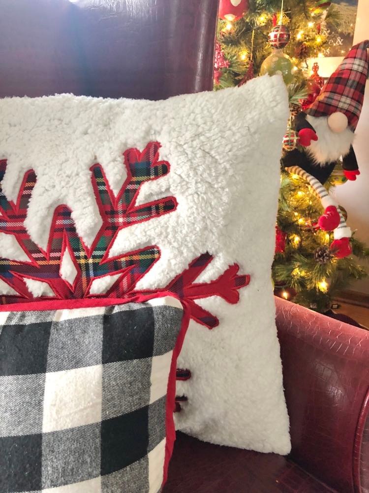 A plaid snowflake pillow.