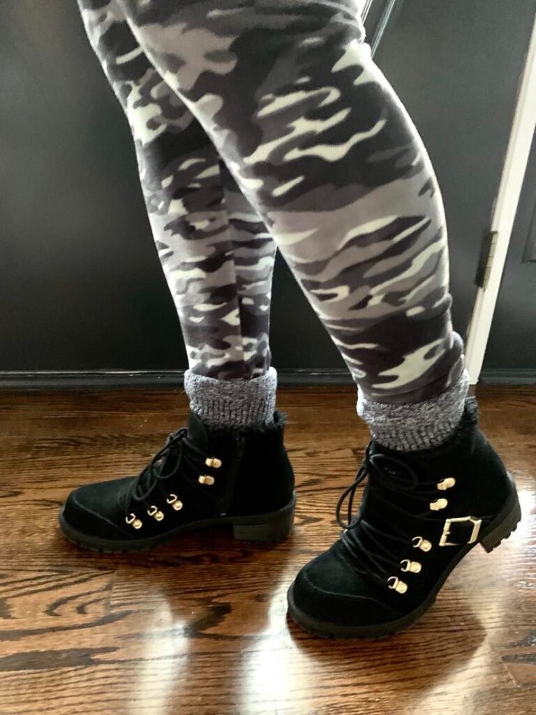All weather boots and velour leggings in a camoflauge pattern.