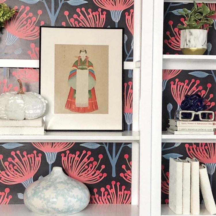 Top Ten DIY Projects - painted bookcase with red and blue wallpaper