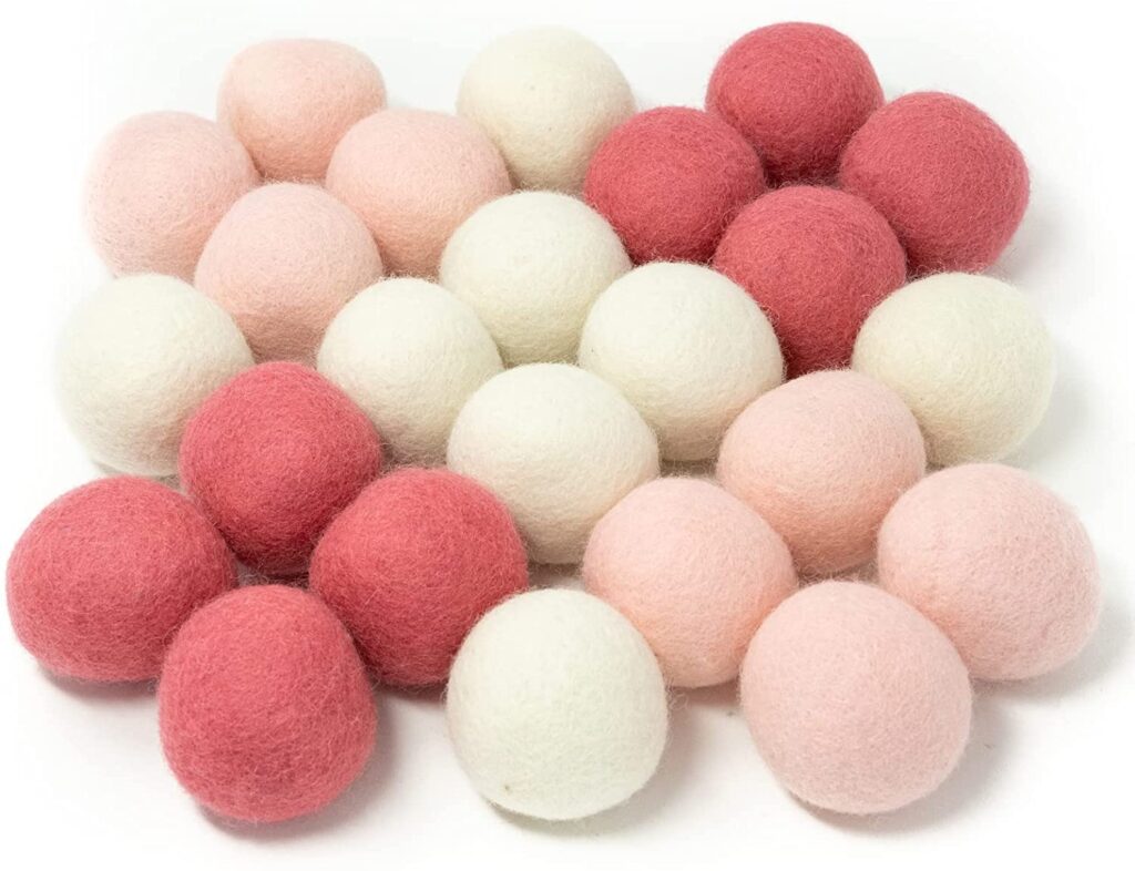 Cream and blush pink wool balls.