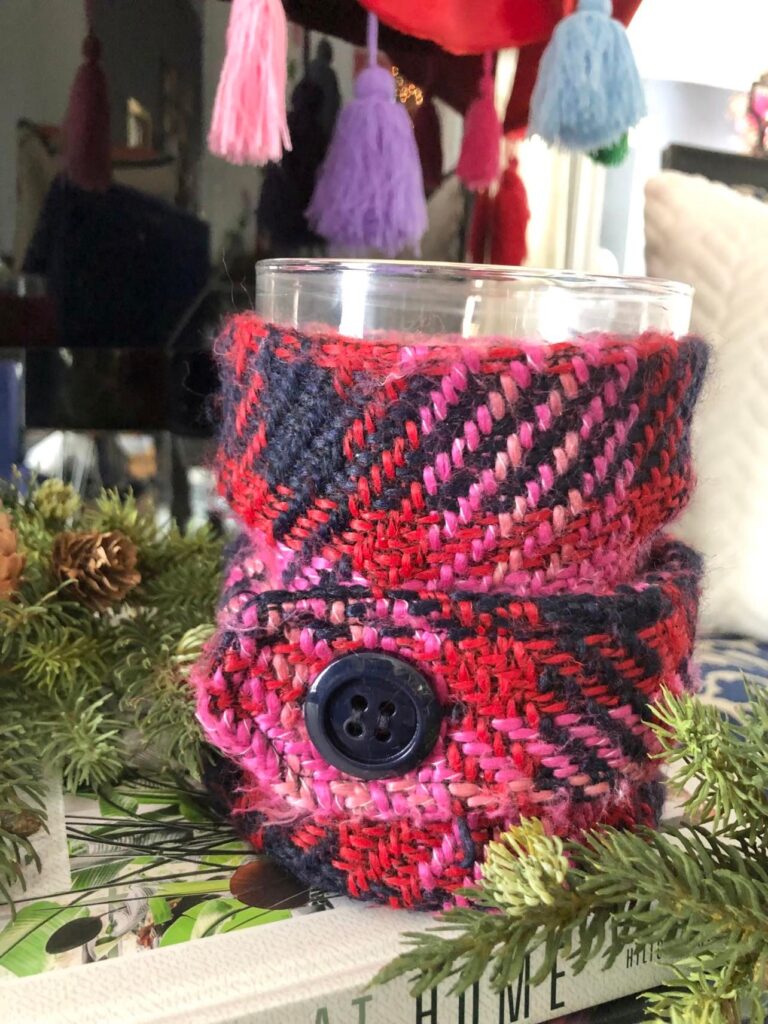 DIY candle wrap using a recycled coat sleeve.
