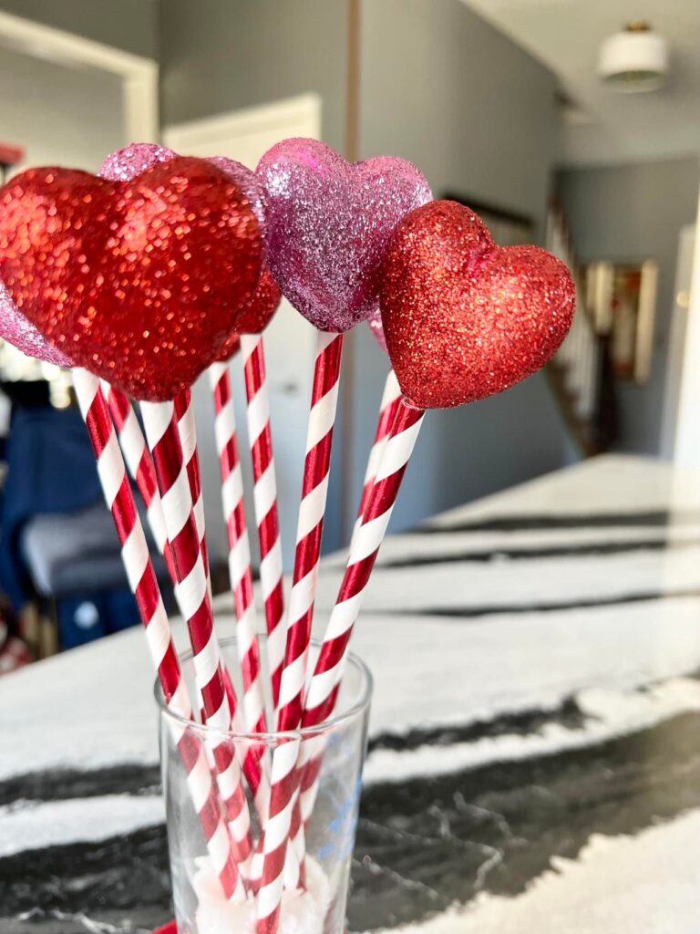 Styrofoam hearts in red and white striped straws make perfect Valentine's Day Home Decor.