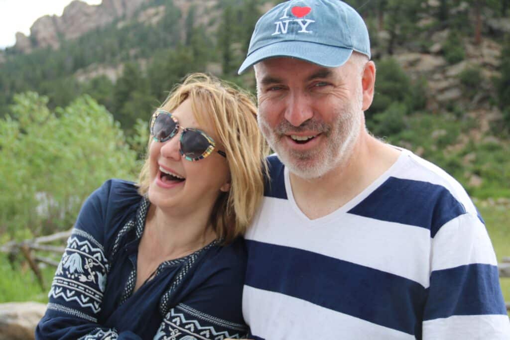 Missy and Brian laughing in the Colorado mountains.