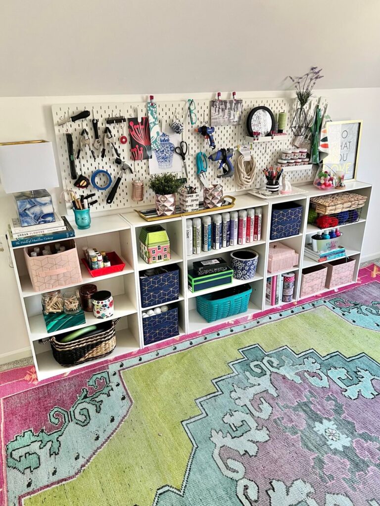 A craft room storage wall that also serves as a vision board.