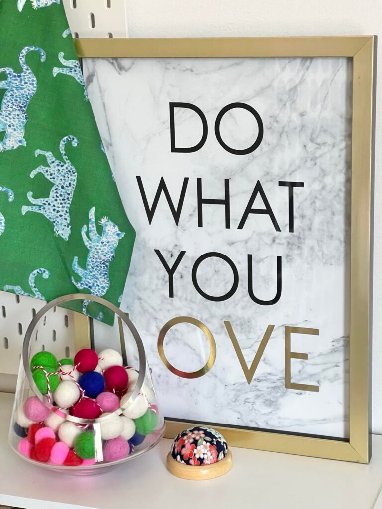 A wall art piece that says "Do What You Love."