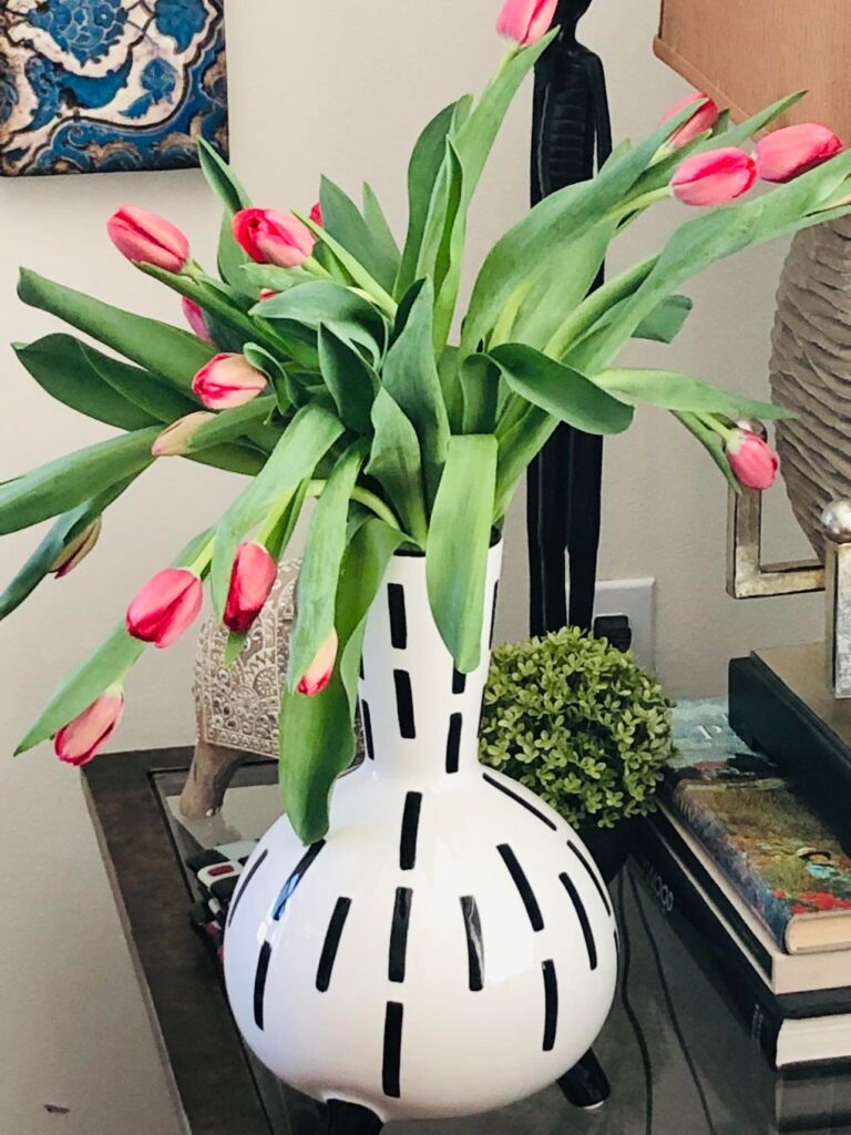 Pink Tulips are the perfect wee bit of green decor with their green stems and leaves.