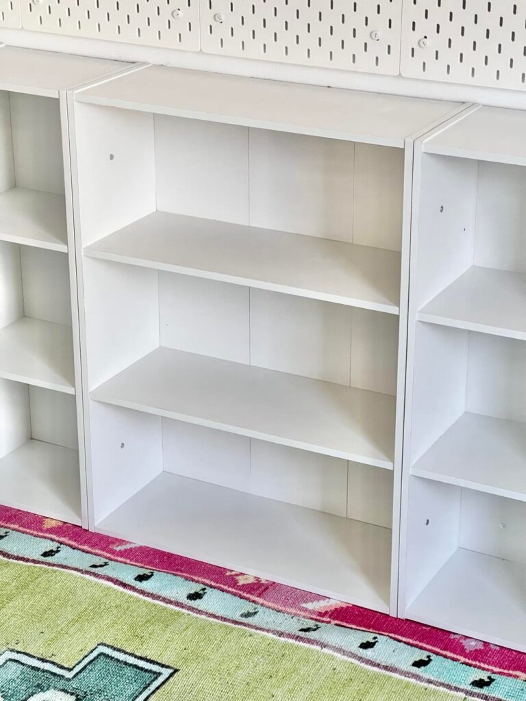 
Short white bookshelves that are a great solution for craft room storage.