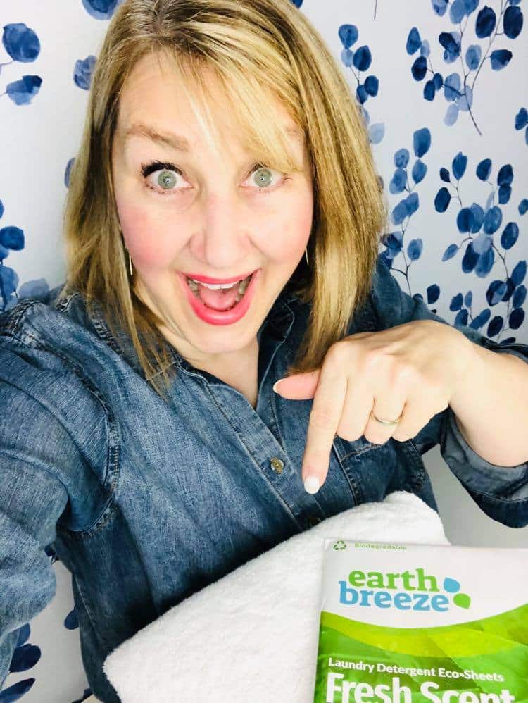 Missy pointing to her favorite wee bit o'green decor in using the Earth Breeze Eco Laundry Sheets.
