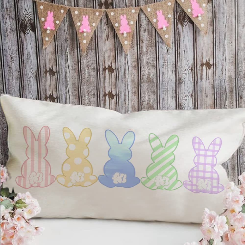A bunny pillow for purchase with 5 differently patterned bunnies in pastel colors.