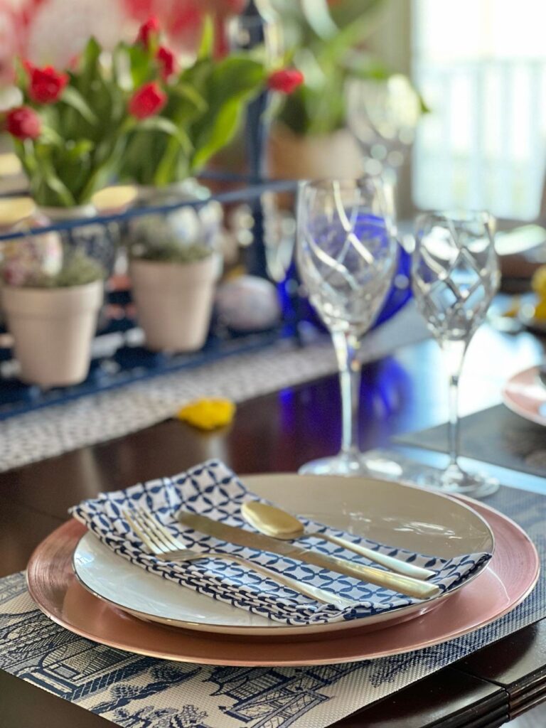 An Easter tablescape with mixed metals in the place setting.
