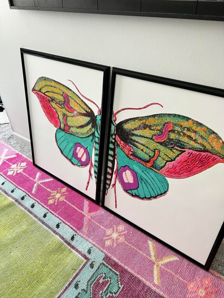A close up of the split "Forest Moth" design in colors of fuschia pink, turquoise, gold, and purple.