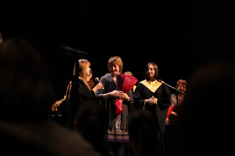 My two daughters giving me flowers at their final high school concert.