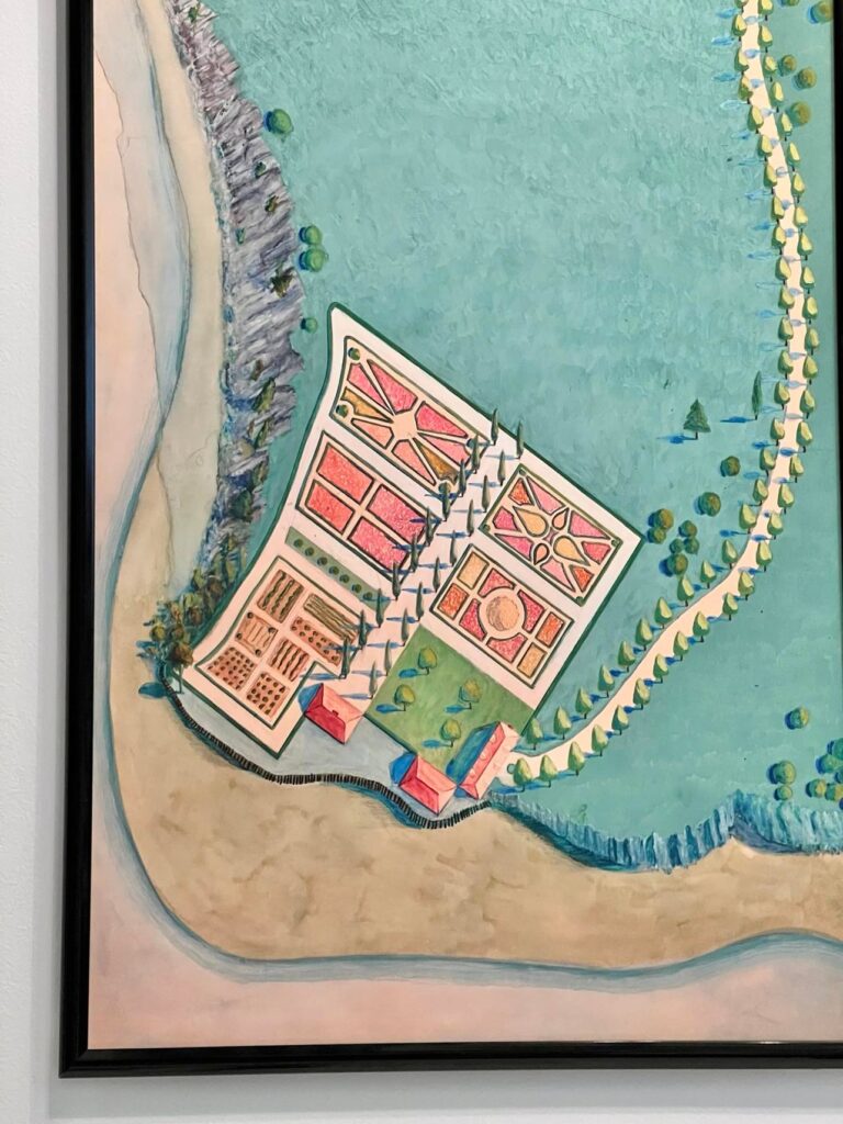 A close up of a vintage garden map in colors of green, coral, yellow, and aqua.
