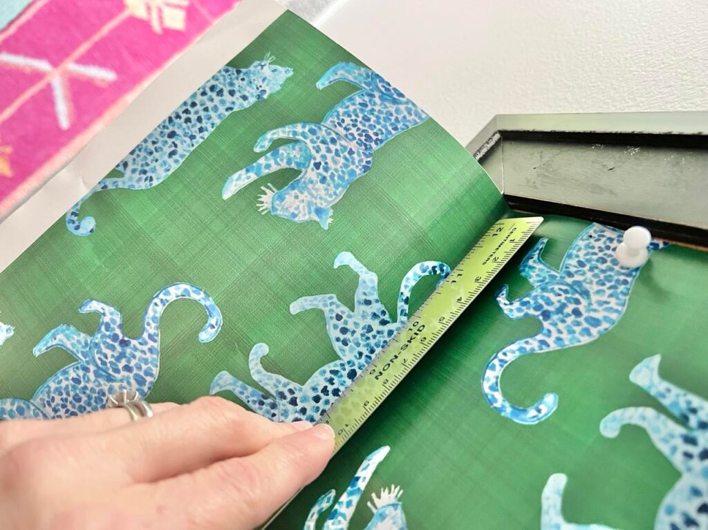 Using a ruler to create a crease in the bottom for clean cleaning.