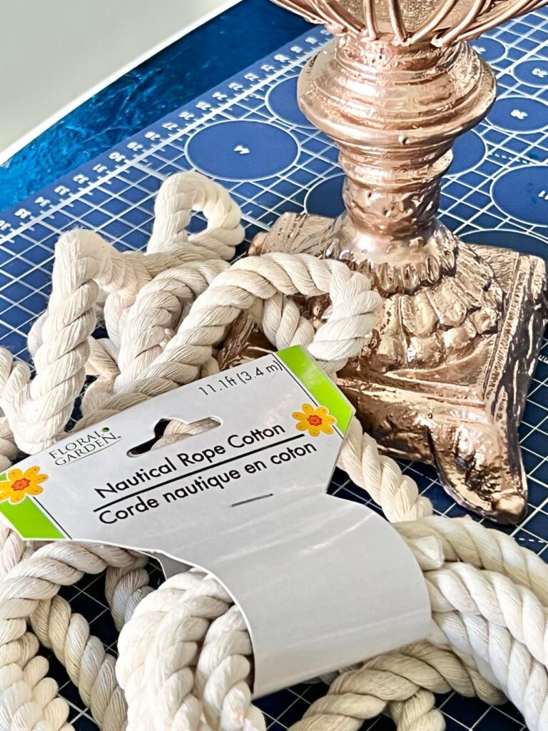 White cotton nautical rope sitting at the base of the vase.