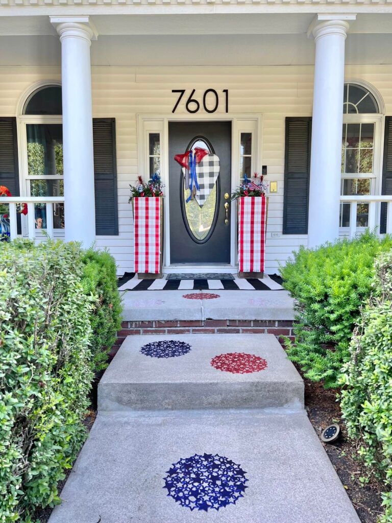 Decorate your porch for July 4th with these red and blue vinyl placemats and this red and cream plaid table runner.
