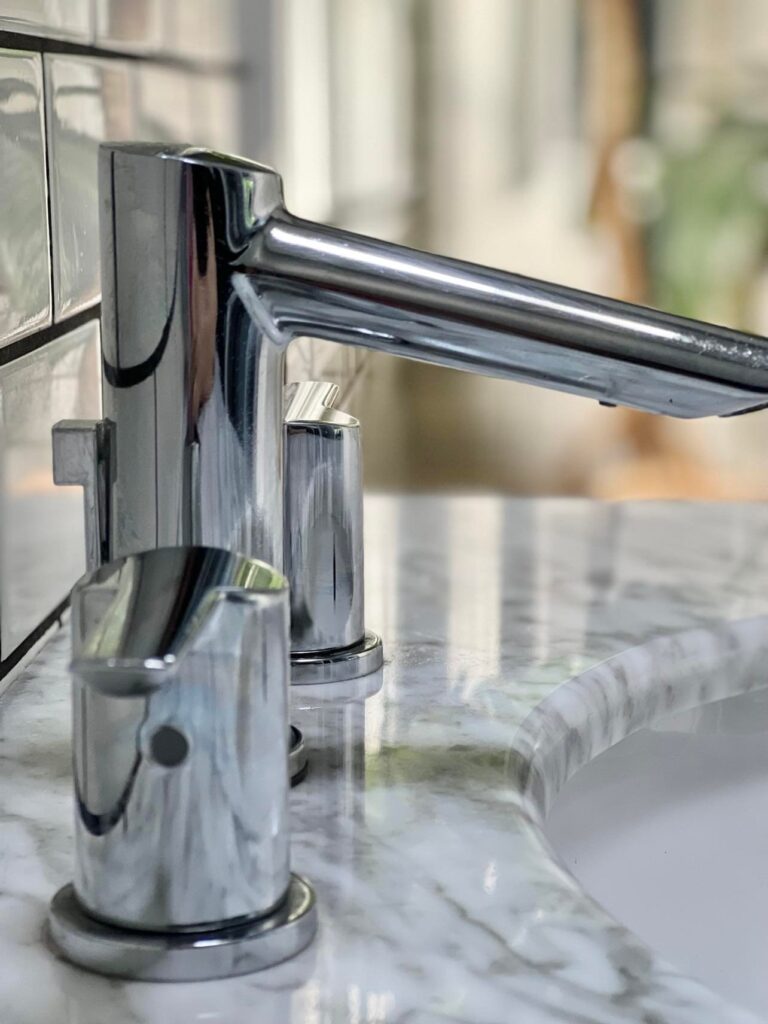 A chrome sink faucet