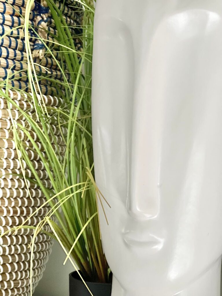 A large white sculpture of a head.