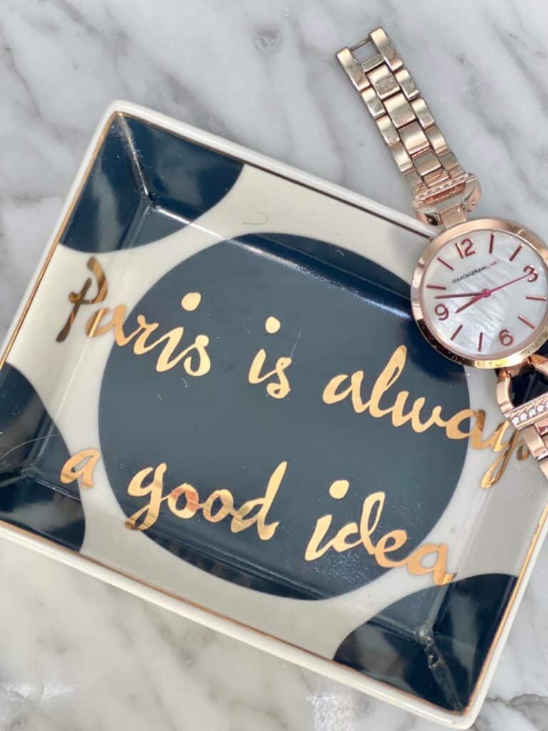 A blue and white tray that says "Paris is always a good idea."