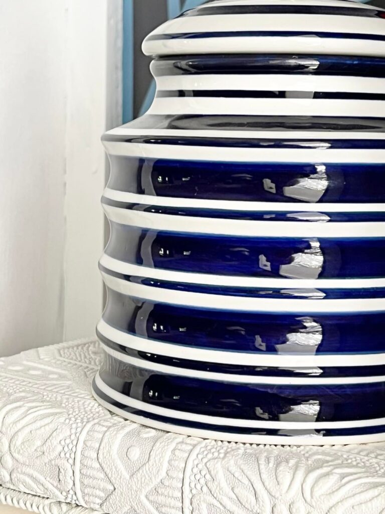 A blue and white striped jar.