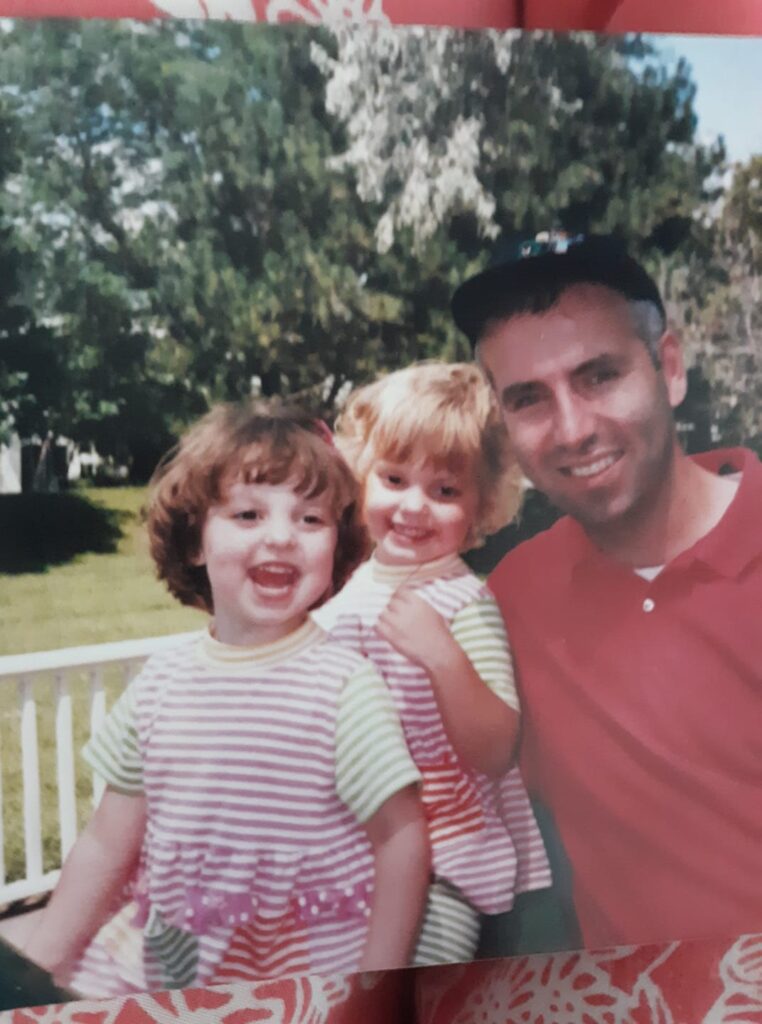 A photo of my husband and my twin daughters when they were three years old.