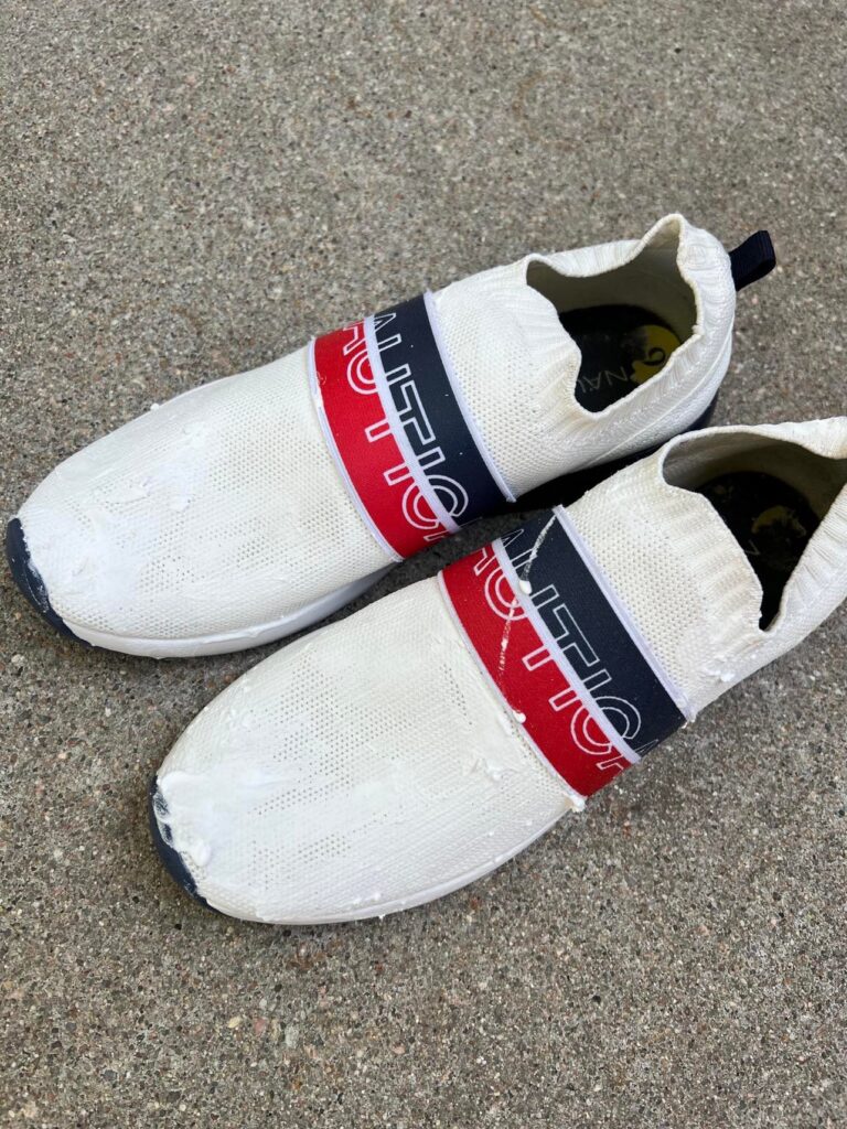 Make white sneakers white again by putting the shoes in the sun after applying the paste.