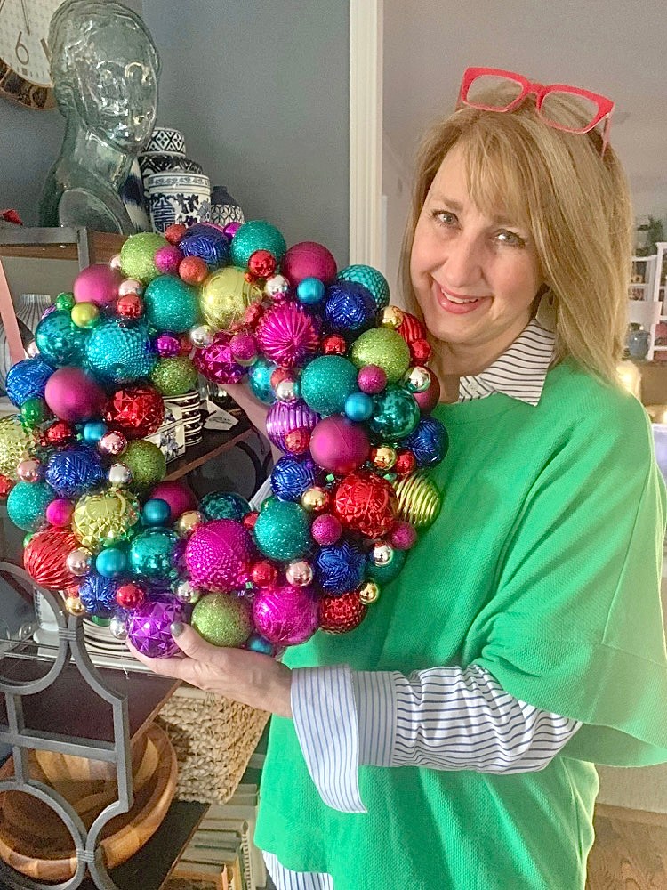 This multi-colored ornament ball wreath display a multi-colored Christmas color scheme.