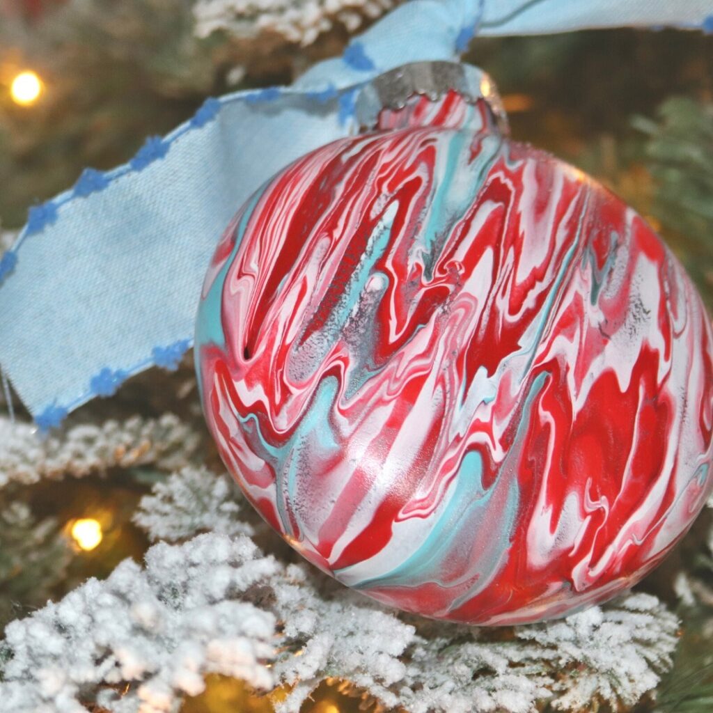 Red, white, and blue is an effective Christmas color scheme as evidenced by this red, white, and blue ornament ball.