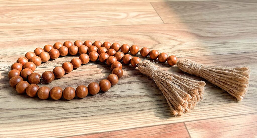 Wood bead garland with jute tassels.