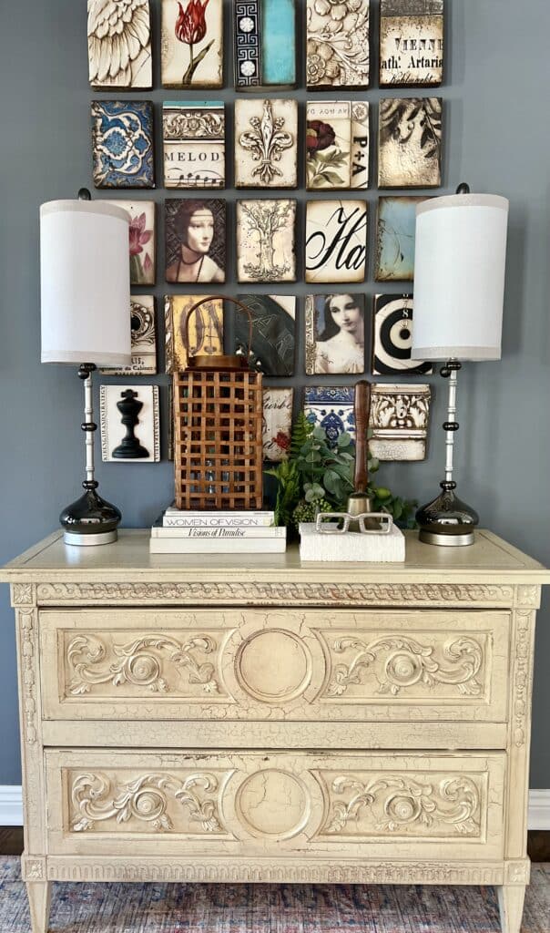 A front entry chest hold a natural wood woven lantern and a schoolteacher bell.